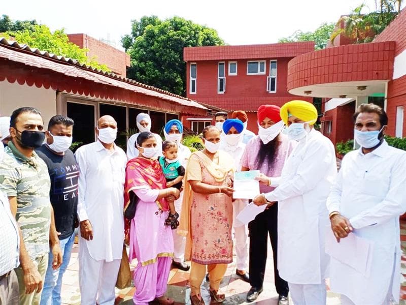 Health Minister Balbir Singh Sidhu hands over cheque of Rs. 3 lakh to panchayat of village Kandala