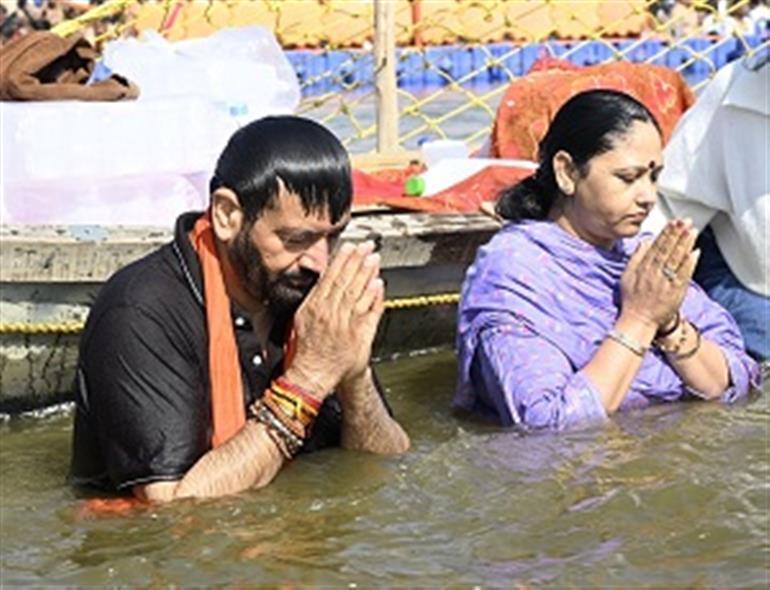 CM Saini takes holy dip in Sangam at Maha Kumbh along with his wife